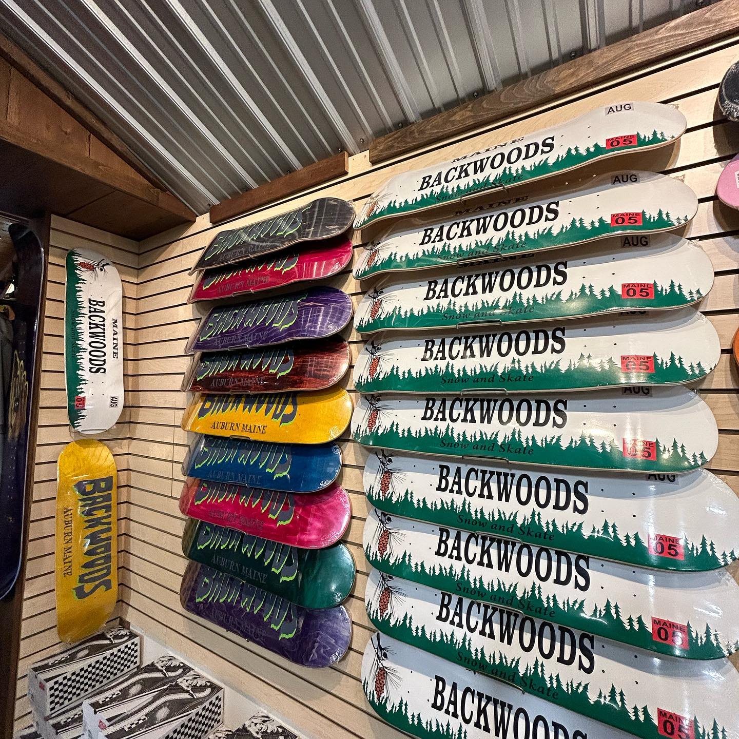 wall of skateboards at Backwoods Snowboards and Skateboards in Auburn Maine