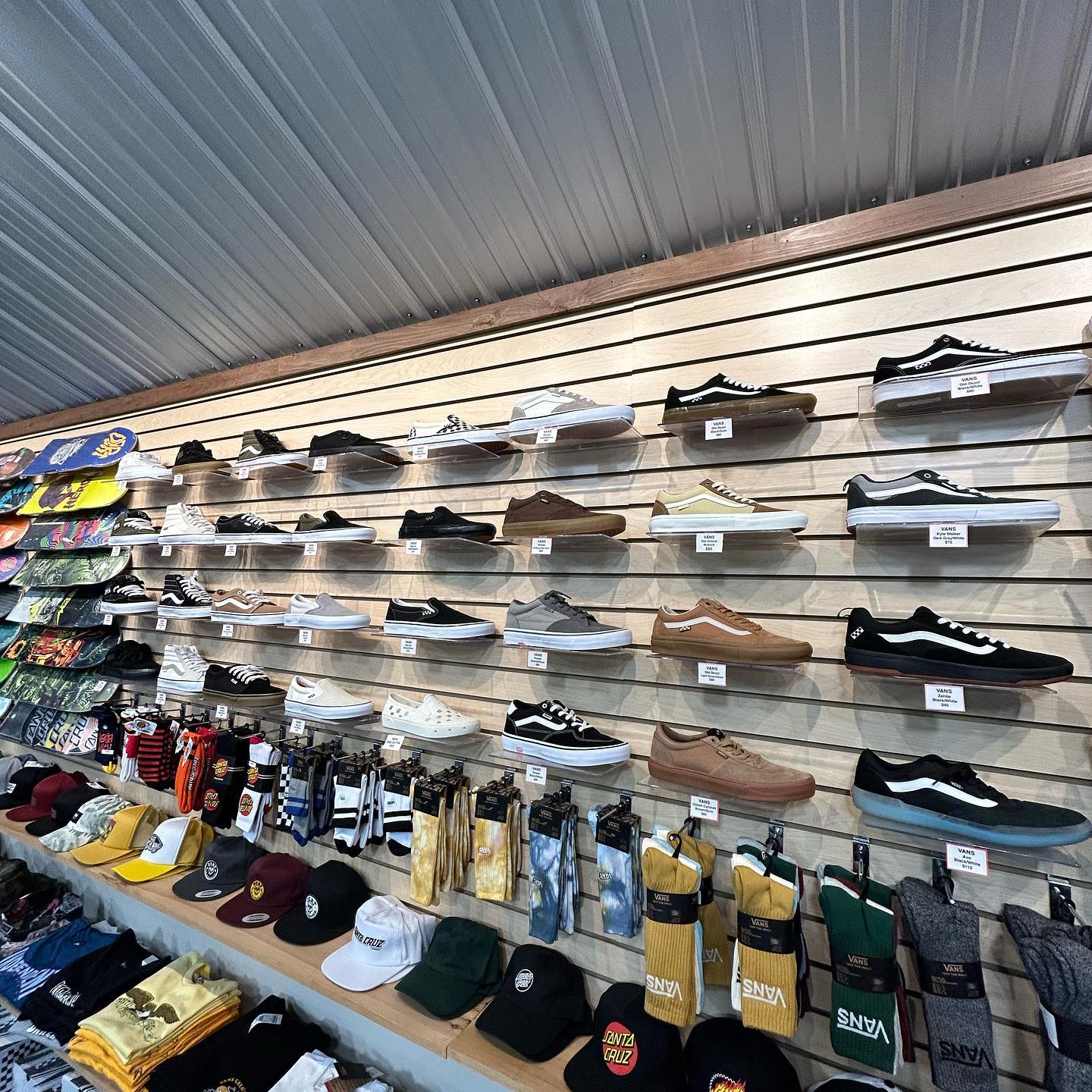 wall of skate shoes and socks at Backwoods Snowboards and Skateboards in Auburn Maine