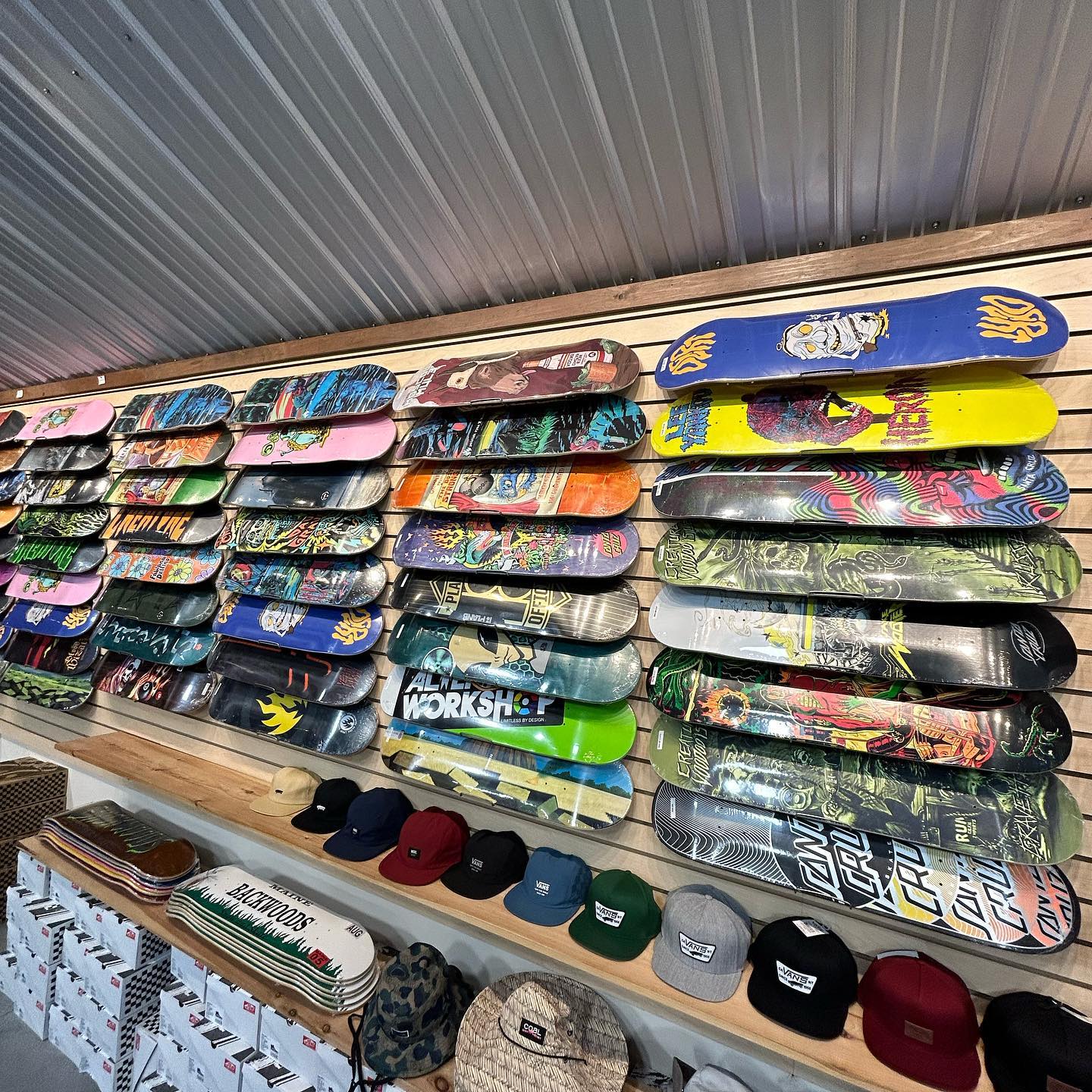 wall of skateboard decks at Backwoods Snow and Skate auburn maine